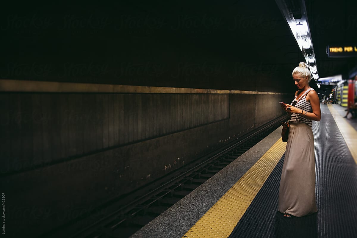 Caucasian Woman Waiting For The Subway Train By Stocksy Contributor