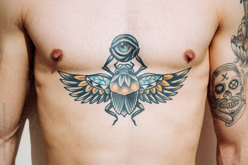 Closeup portrait of chest tattooed man