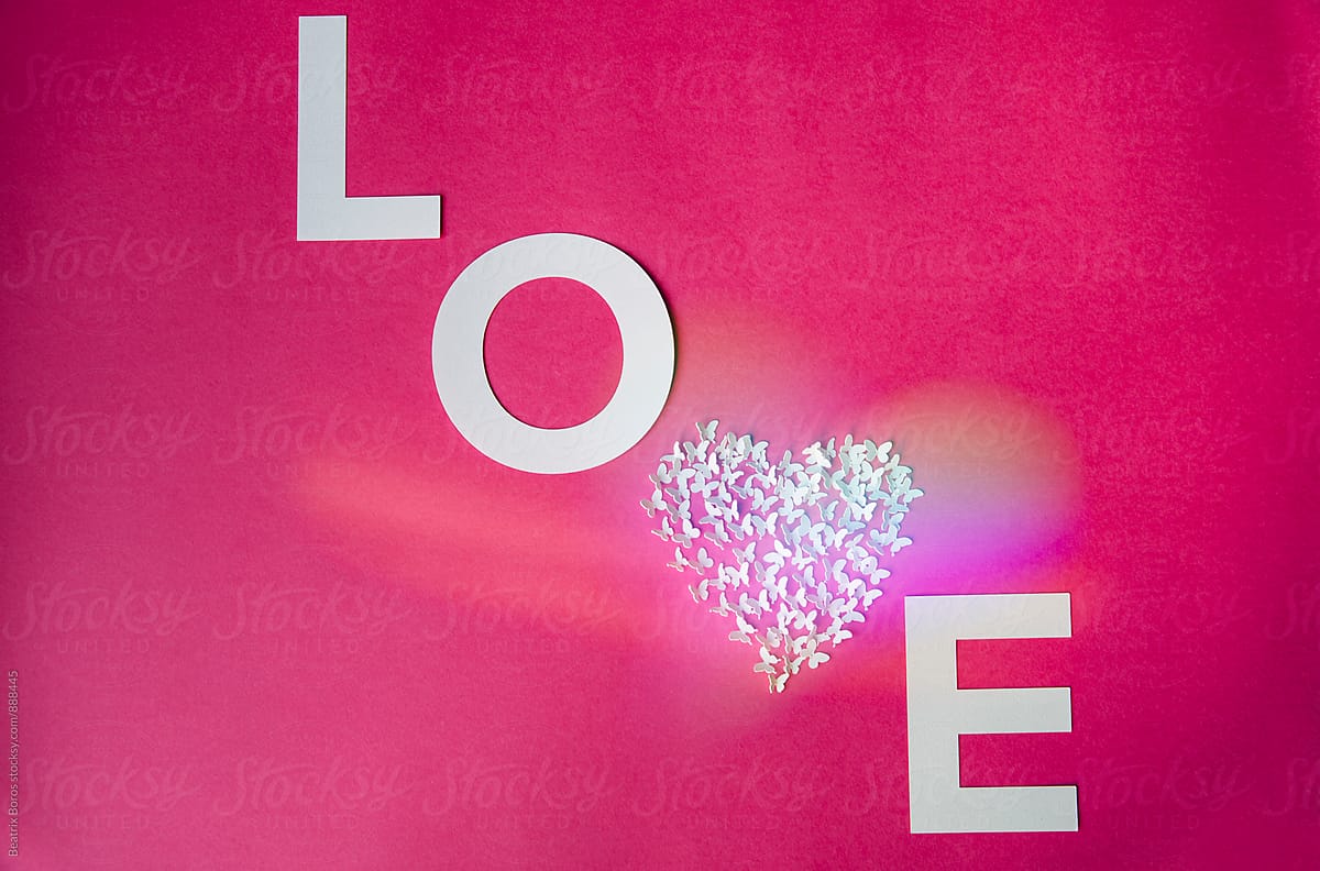 Love made of letters and heart shape with heart shaped reflection