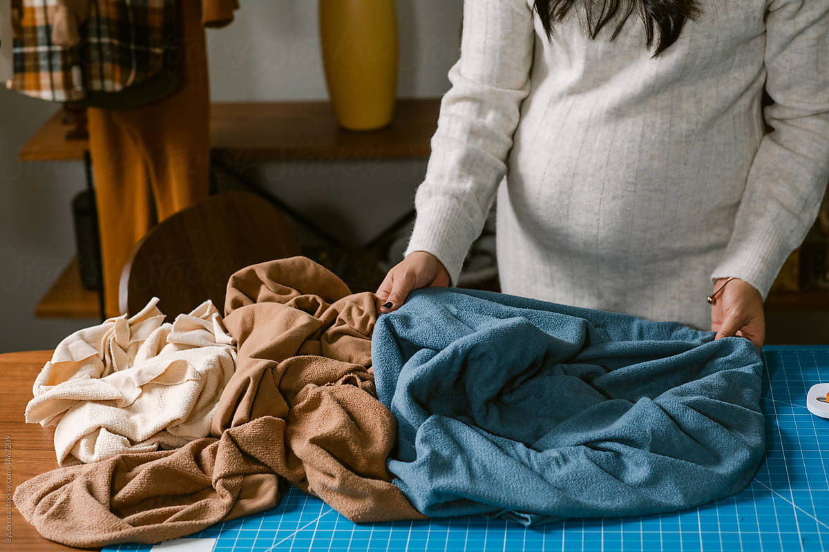 Pregnant touching airy organic fabrics