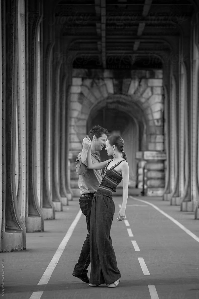 Couple Dancing Under A Bridge In Paris | Stocksy United