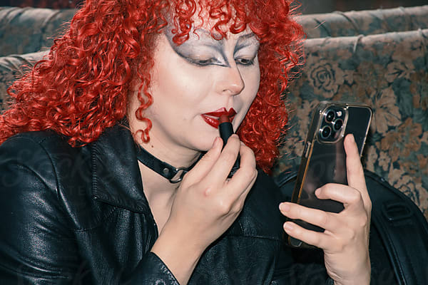 Drag Queen Helping Her Friend To Do Her Goth Make Up by Stocksy  Contributor Laura Herrera - Stocksy