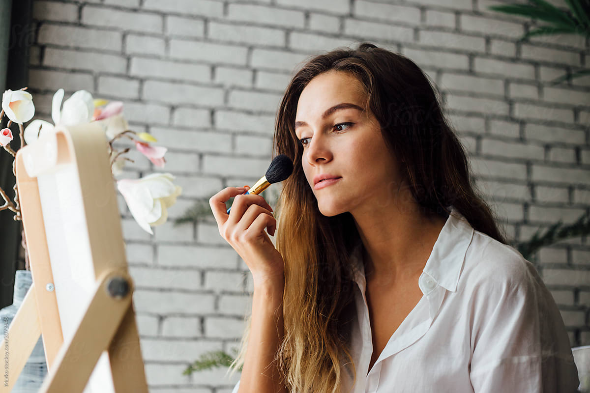 Woman Doing Makeup At Home Del Colaborador De Stocksy Marko Stocksy