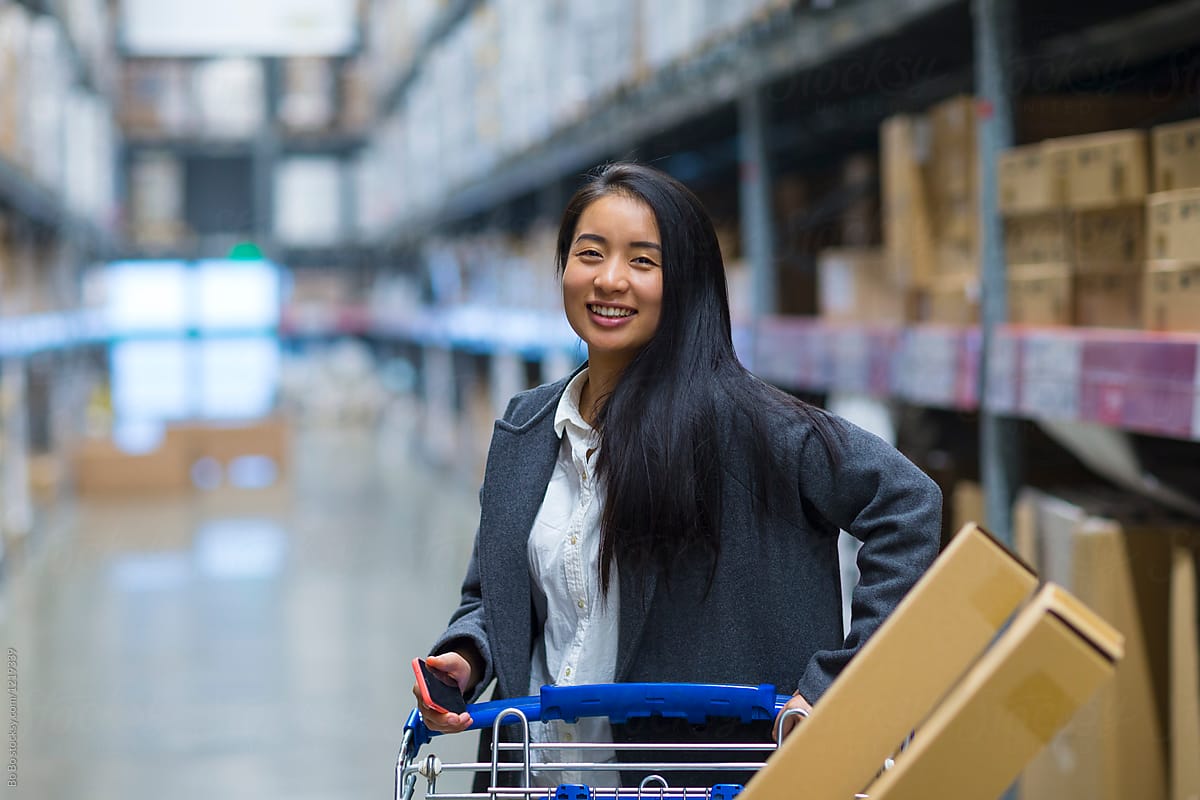 Young Woman Shopping in the warehouse-type supermarket