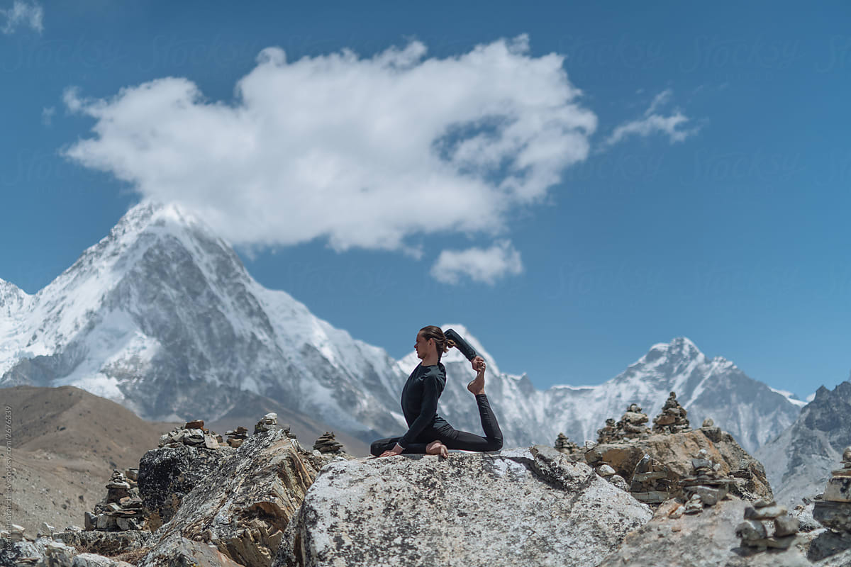 Man Doing Yoga In Himalayan Mountain
