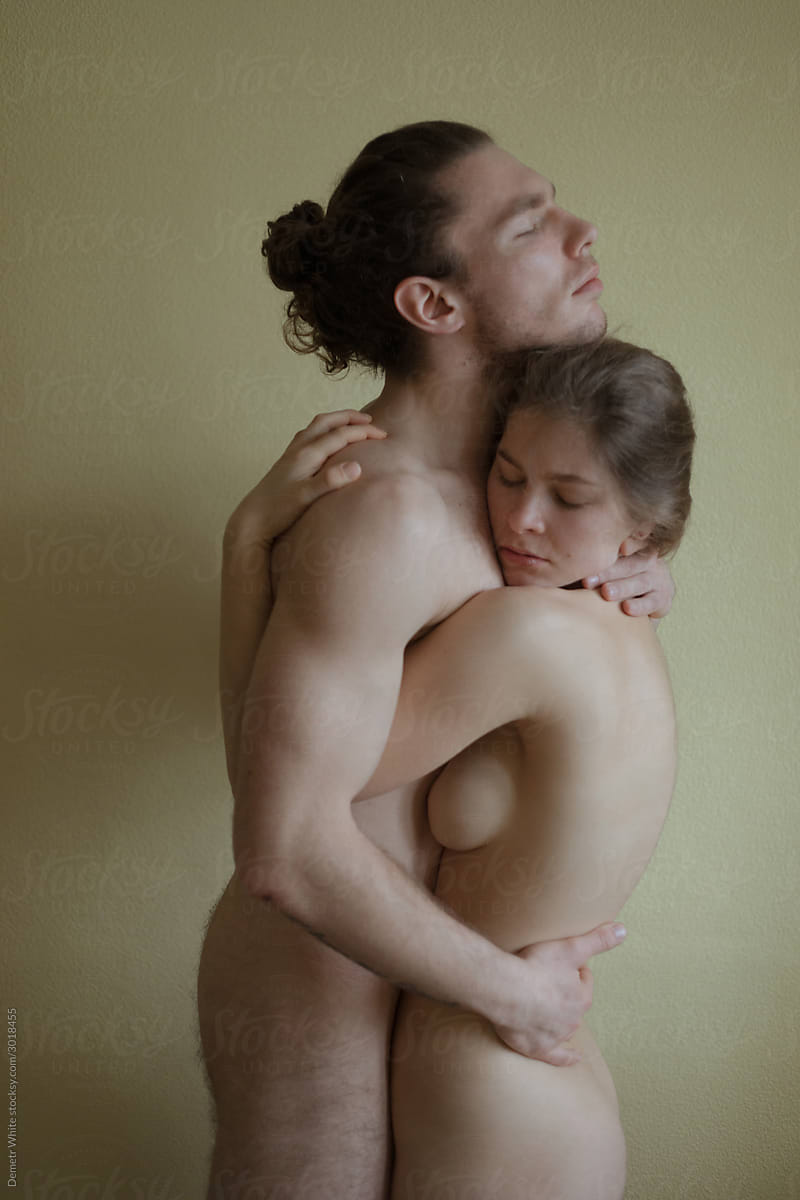 Beautiful Photo Of Naked Couple Hugging On Neutral Background. by Stocksy  Contributor Demetr White - Stocksy