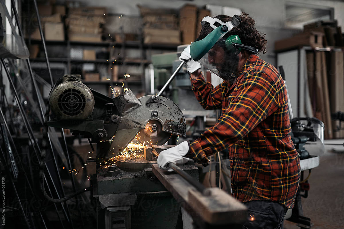 Carpenter with Protective Glasses Working
