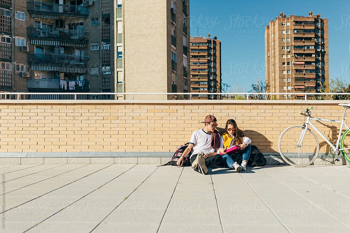 Teenagers Doing Homework In The Street By Stocksy Contributor Victor Torres Stocksy 8852