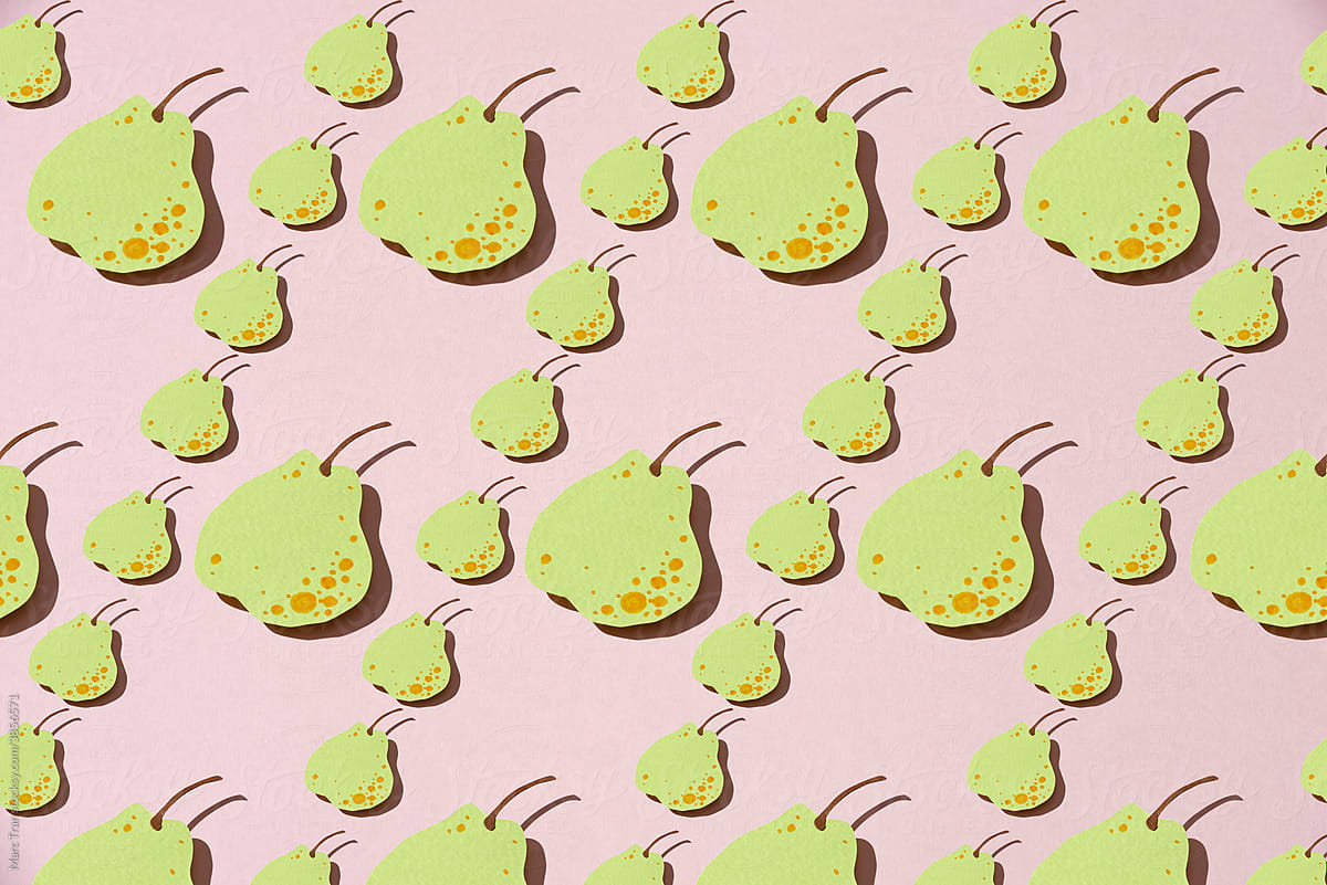 paper pears whole on pink background.