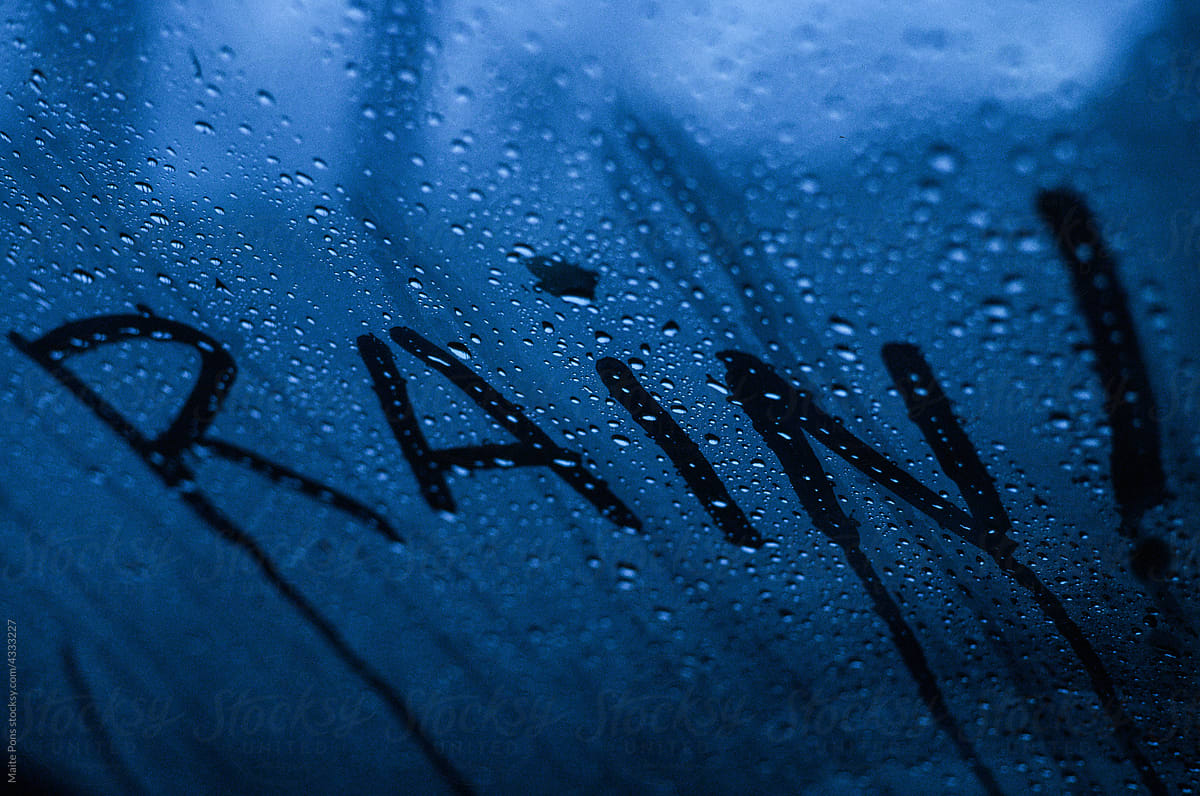 Word Rain written on wet window