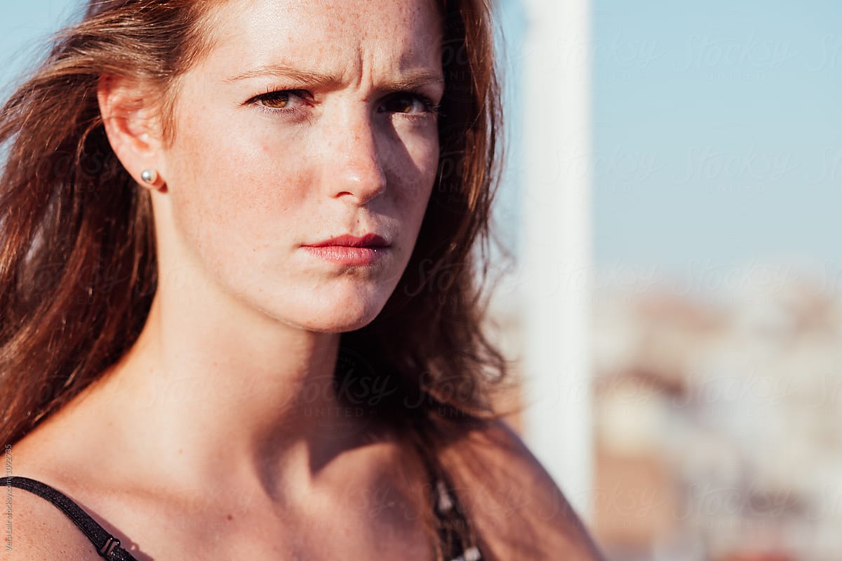 Close Up Of A Serious Freckled Woman By Stocksy Contributor Vera