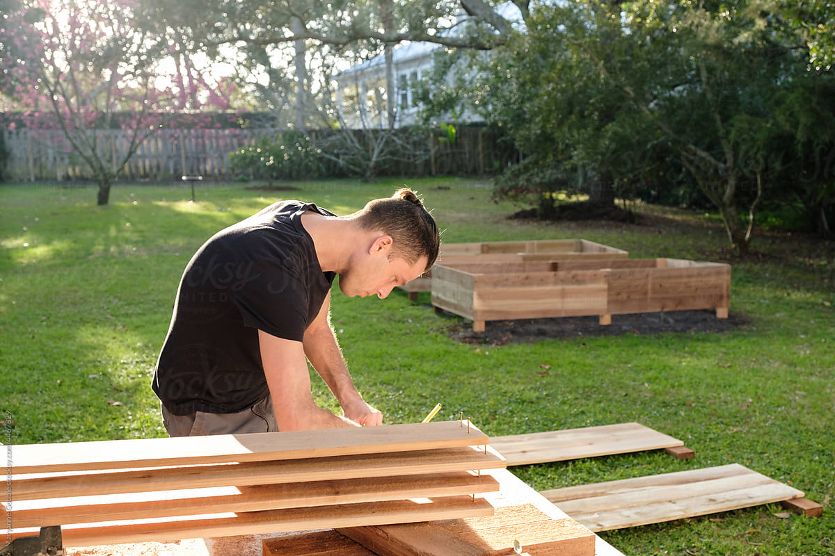 Man Building Raised Garden Beds