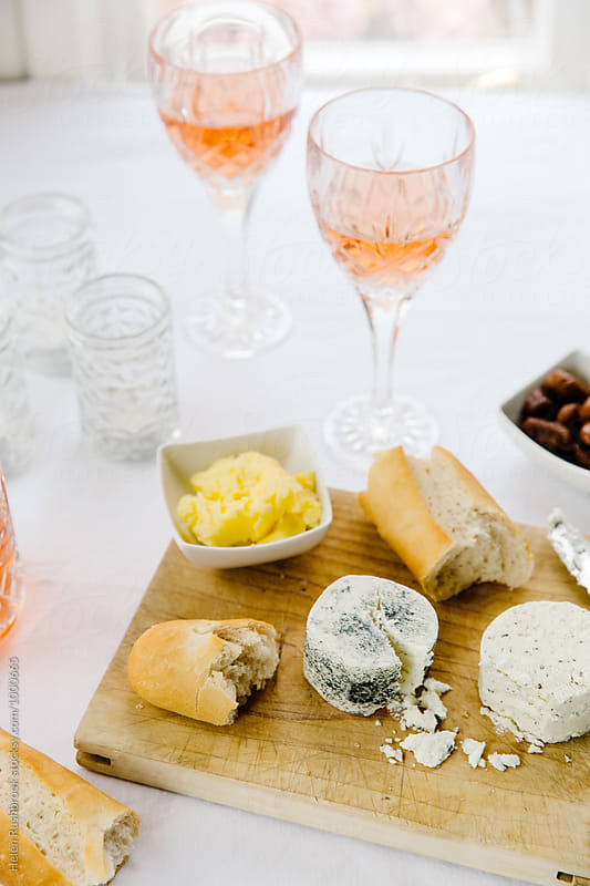 Rose wine, cheese, bread and preserved figs.
