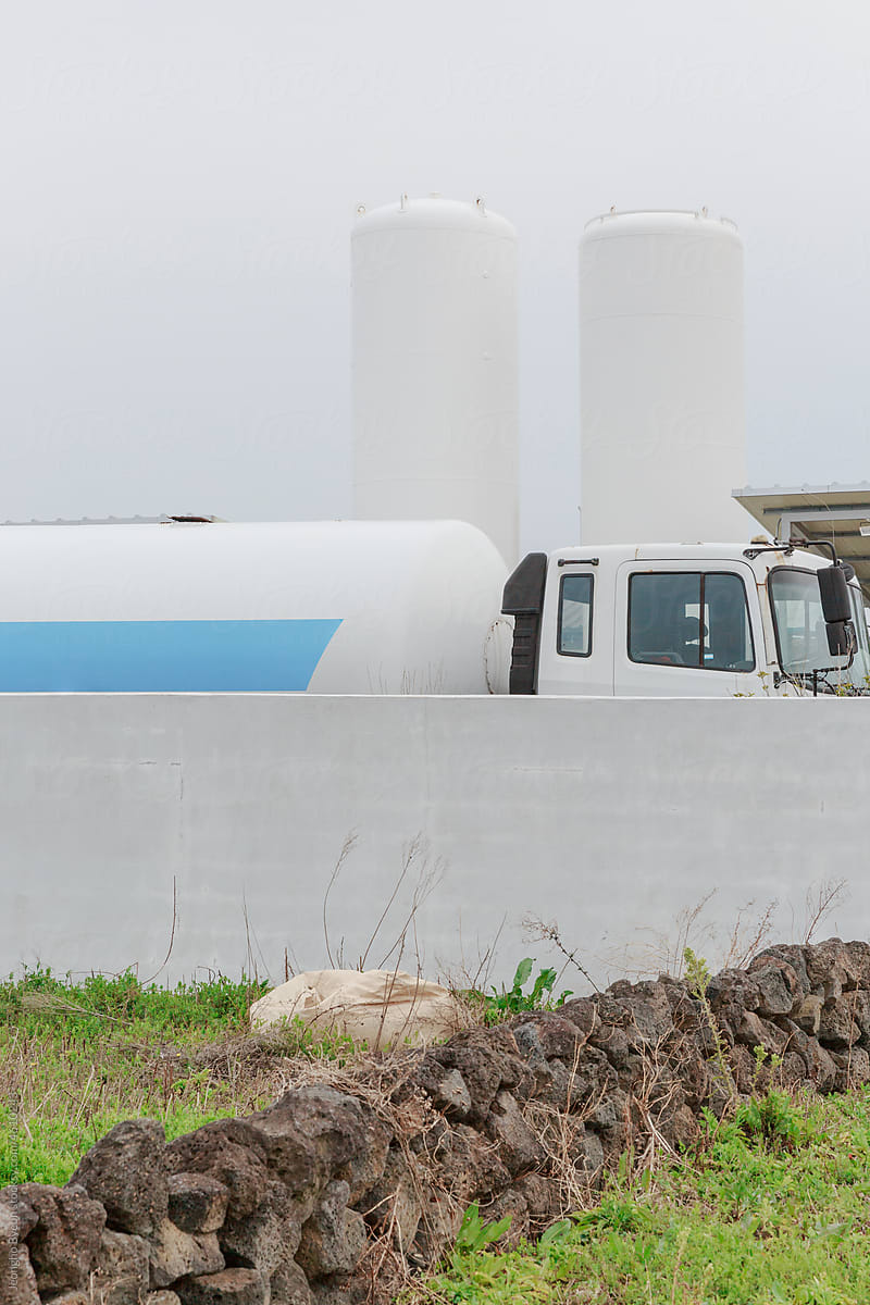 Close-up of White Storage Tank and Truck.