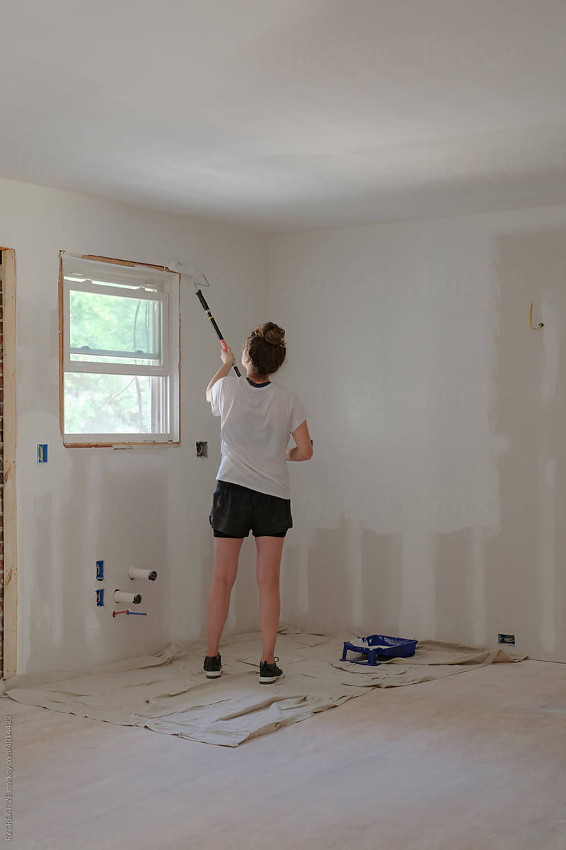 Woman painting house projects