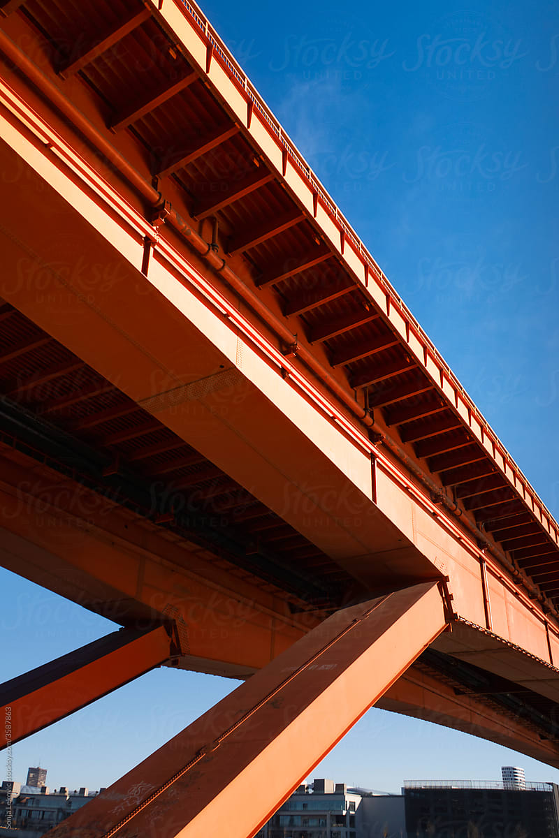 orange bridge construction detail and blue sky