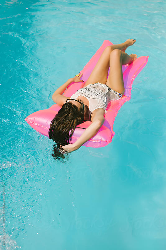 Woman Relaxing in the Pool