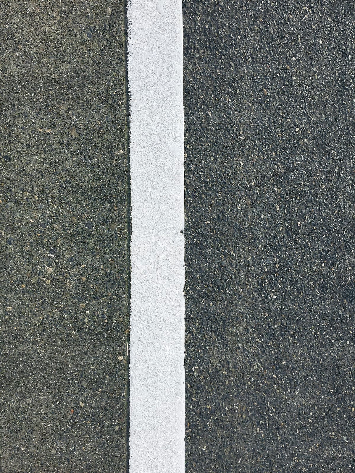 Close up of freshly painted street curb