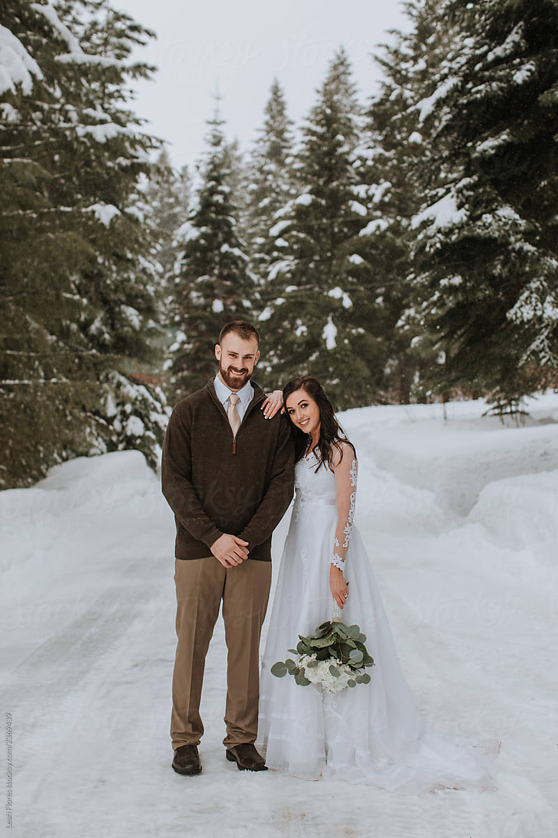 Portrait of Wedding Couple in Winter Landscape