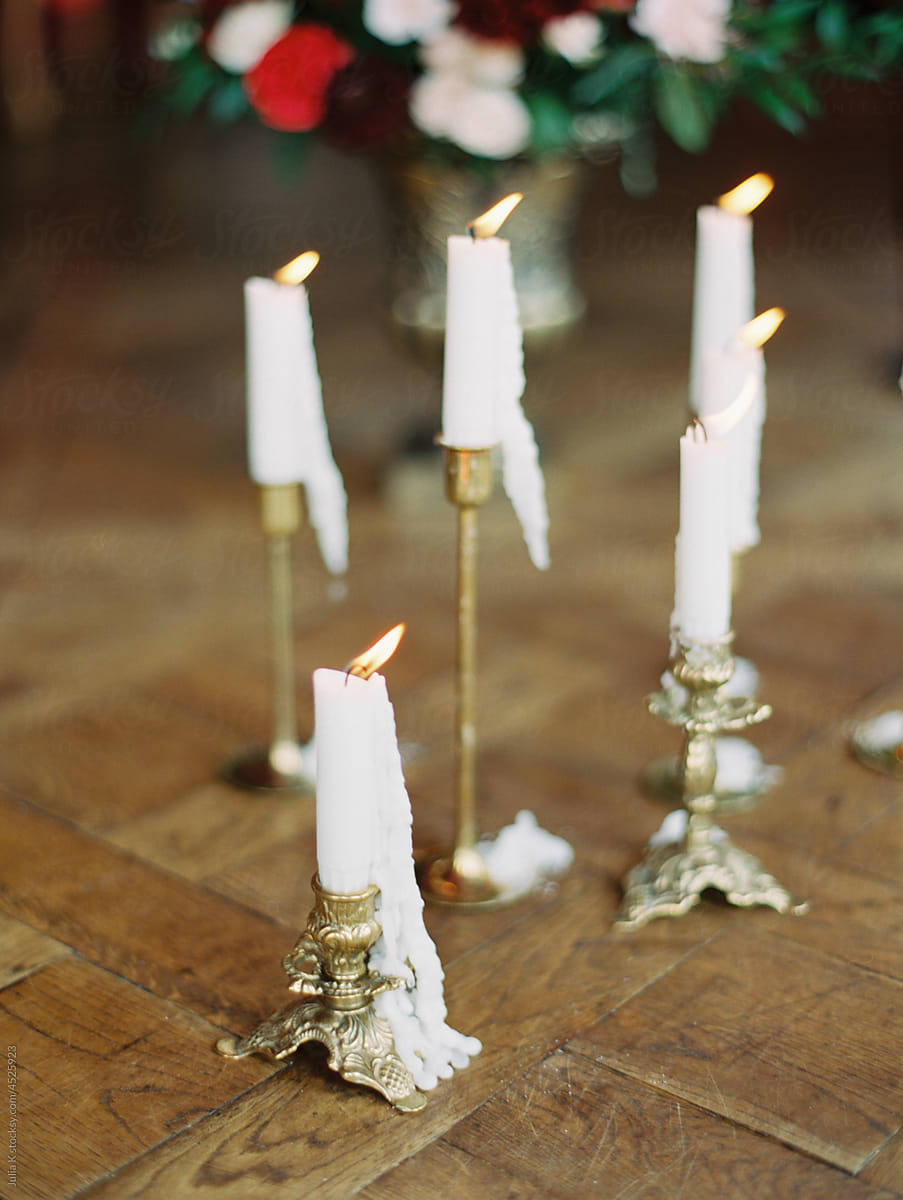 White Wax Candles On Wooden Floor