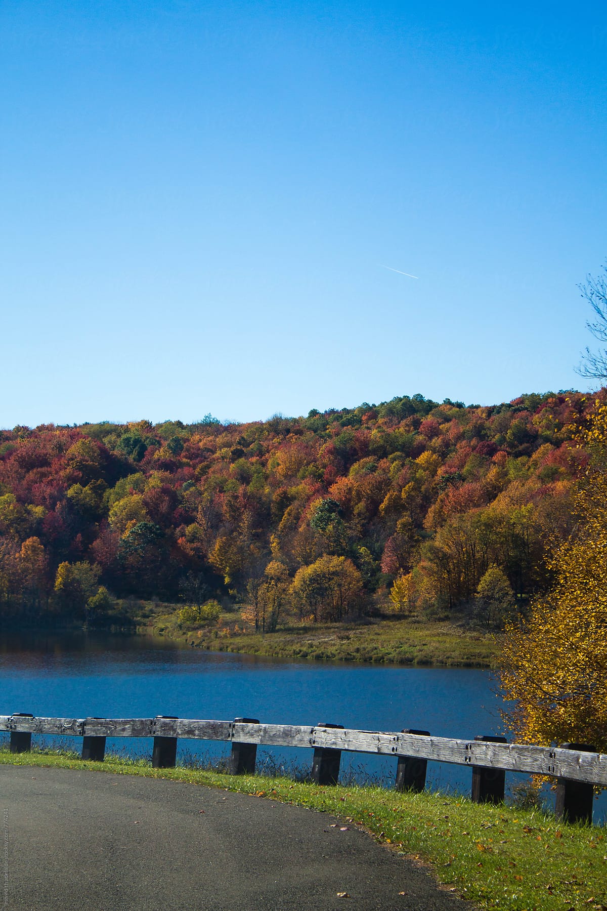 Lake Overlooking Colorful Autumn Hills