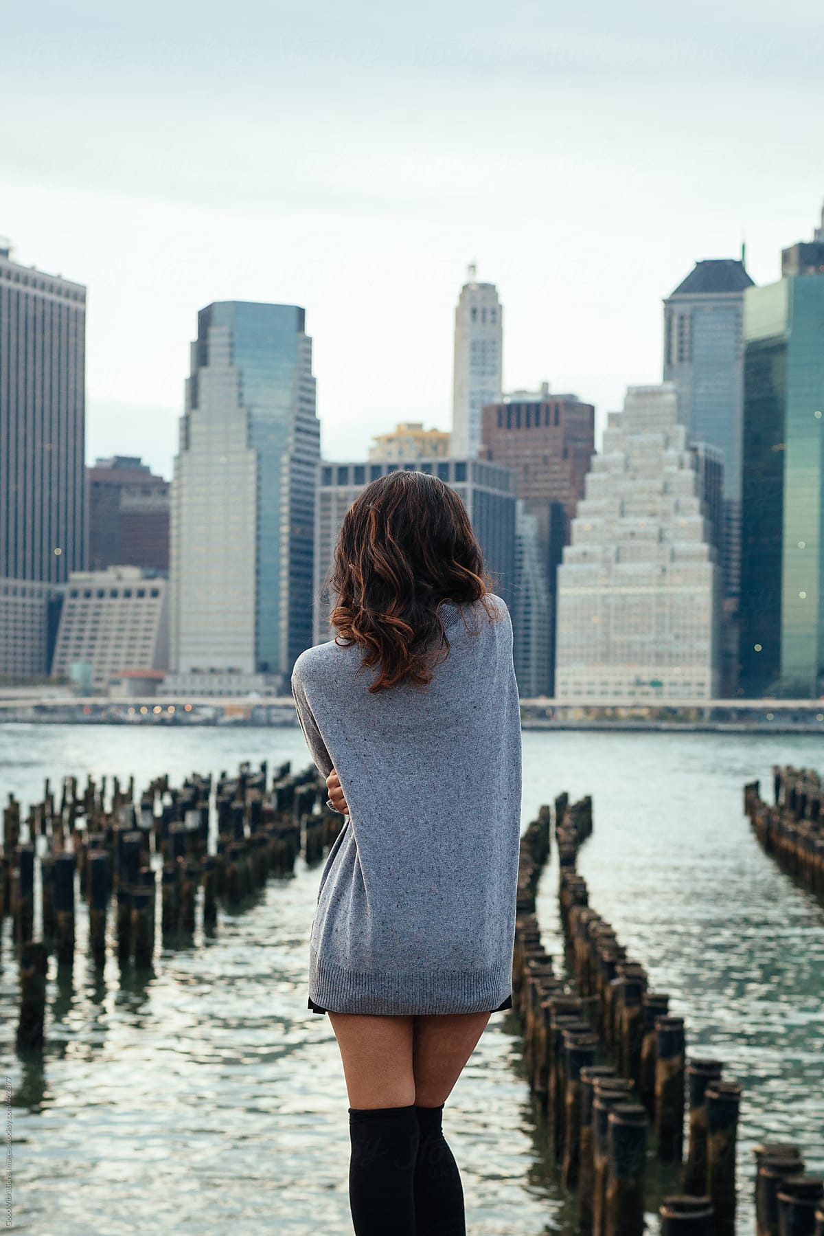 Woman enjoying the view of Manhattan at Sunset