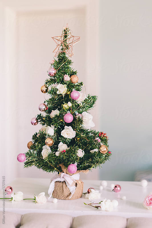 pretty pink and copper decorations on a mini xmas tree, with fre