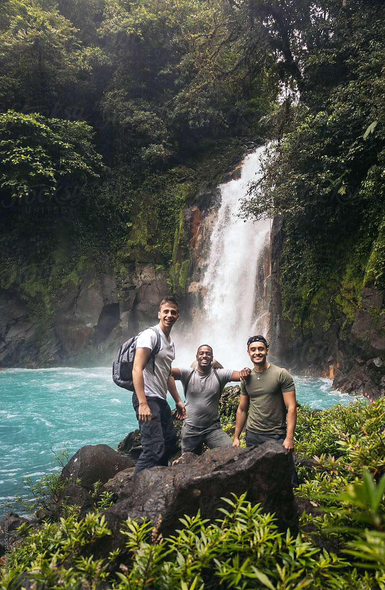 Friends visiting the Rio Celeste waterfall in Costa Rica