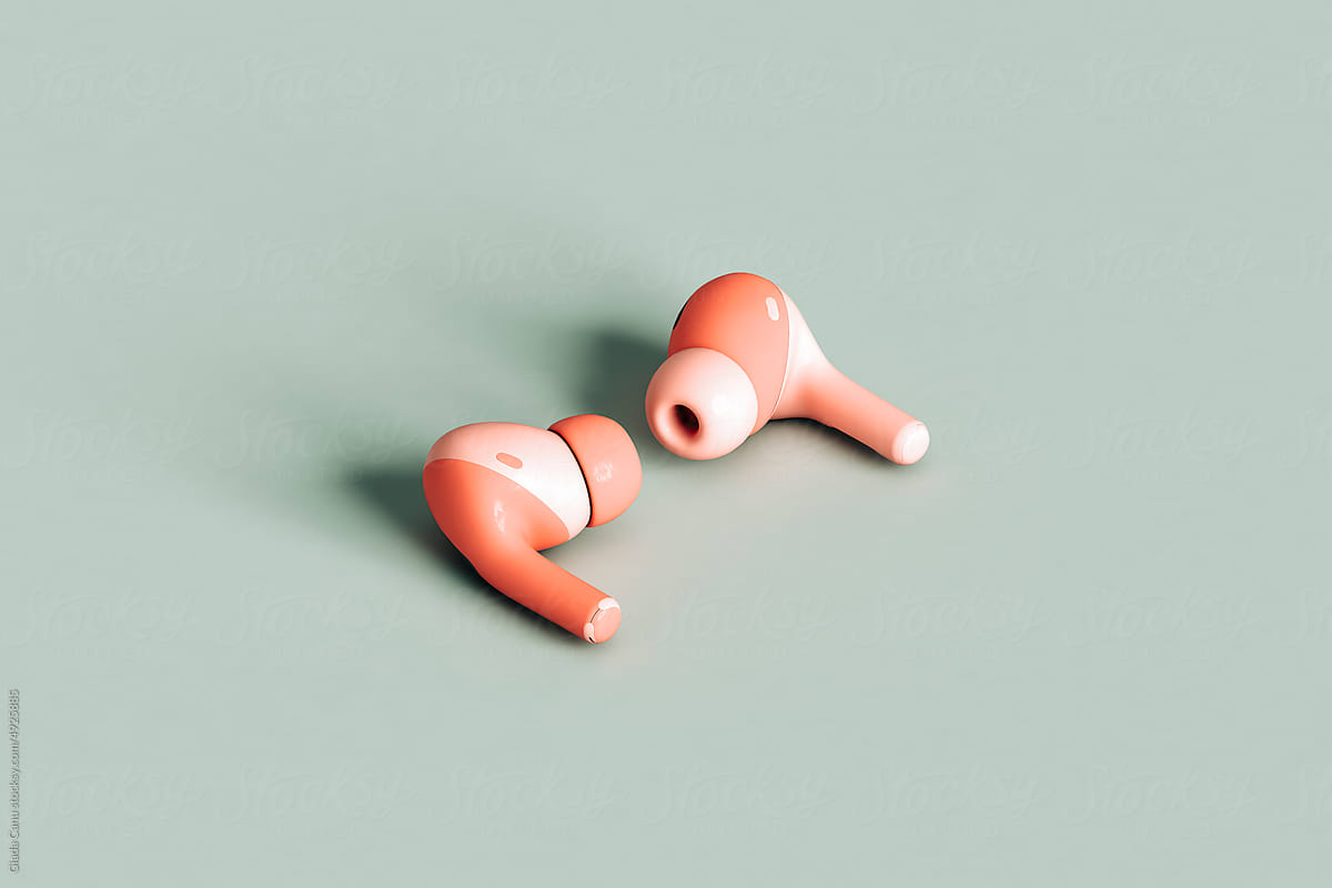 a pair of pink bluetooth earphones