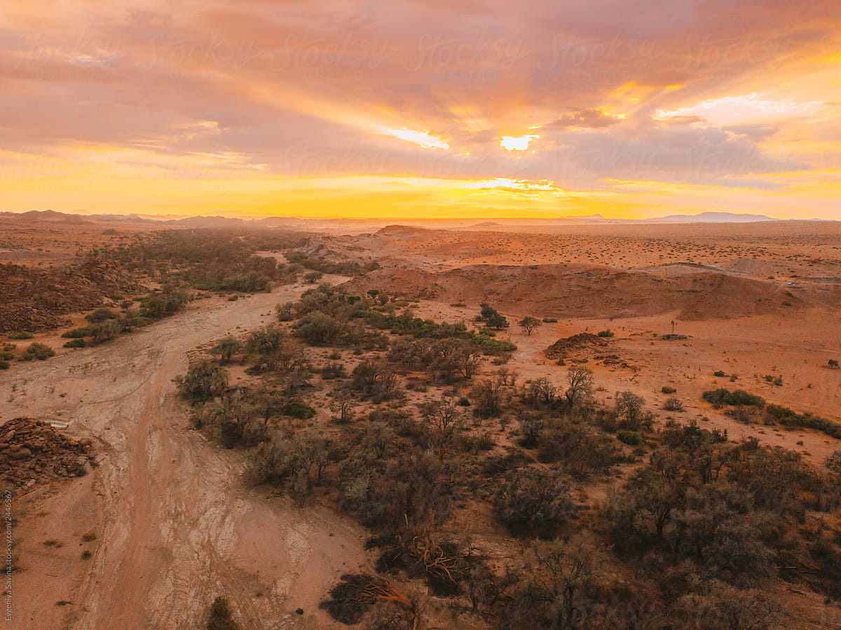 A Drone Shot Of A River Bed In Desert Of Namibia" by "Evgeniya Savina" - Stocksy