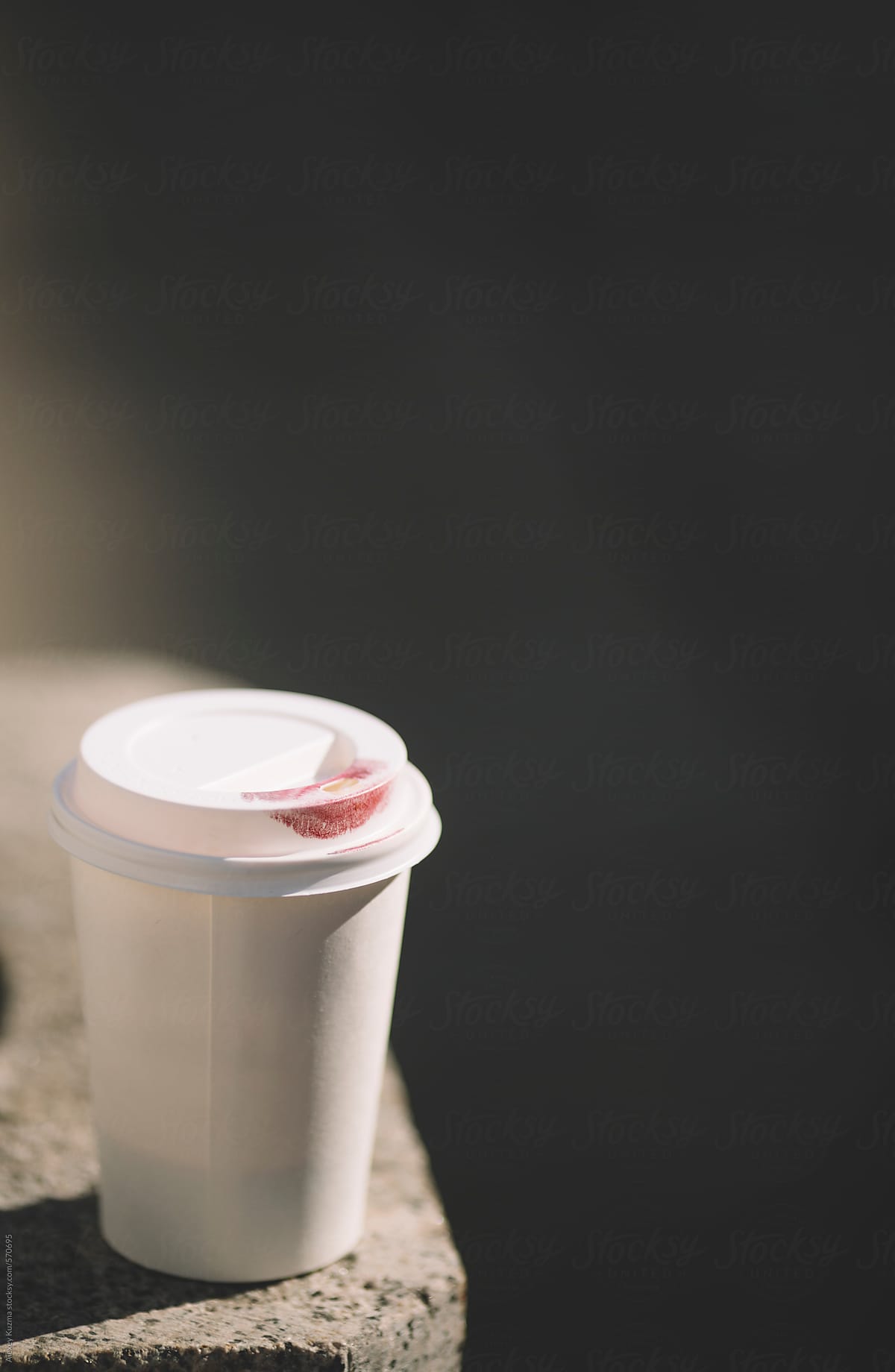 paper drinking cup with lipstic print