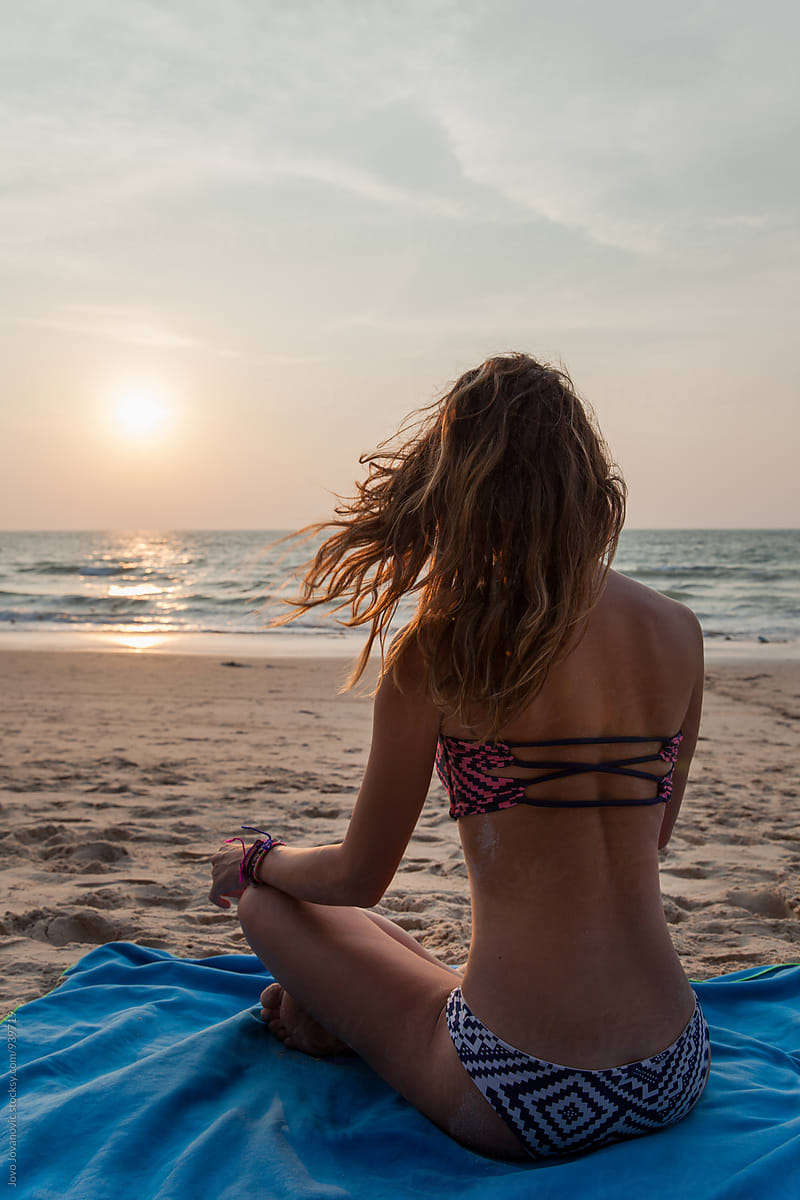 Woman In Bikini Sitting At The Beach Enjoying Sunset By Jovo Jovanovic 