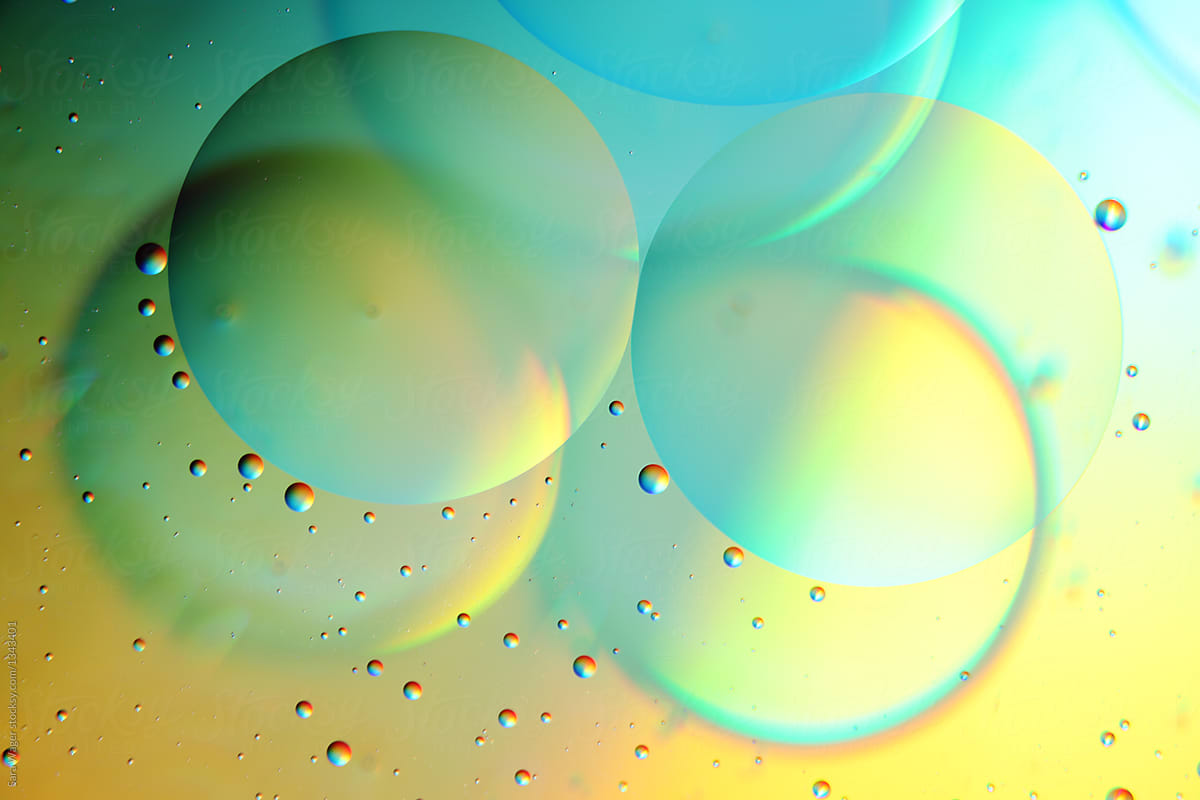 Oil on water colourful yellow and blue bubbles