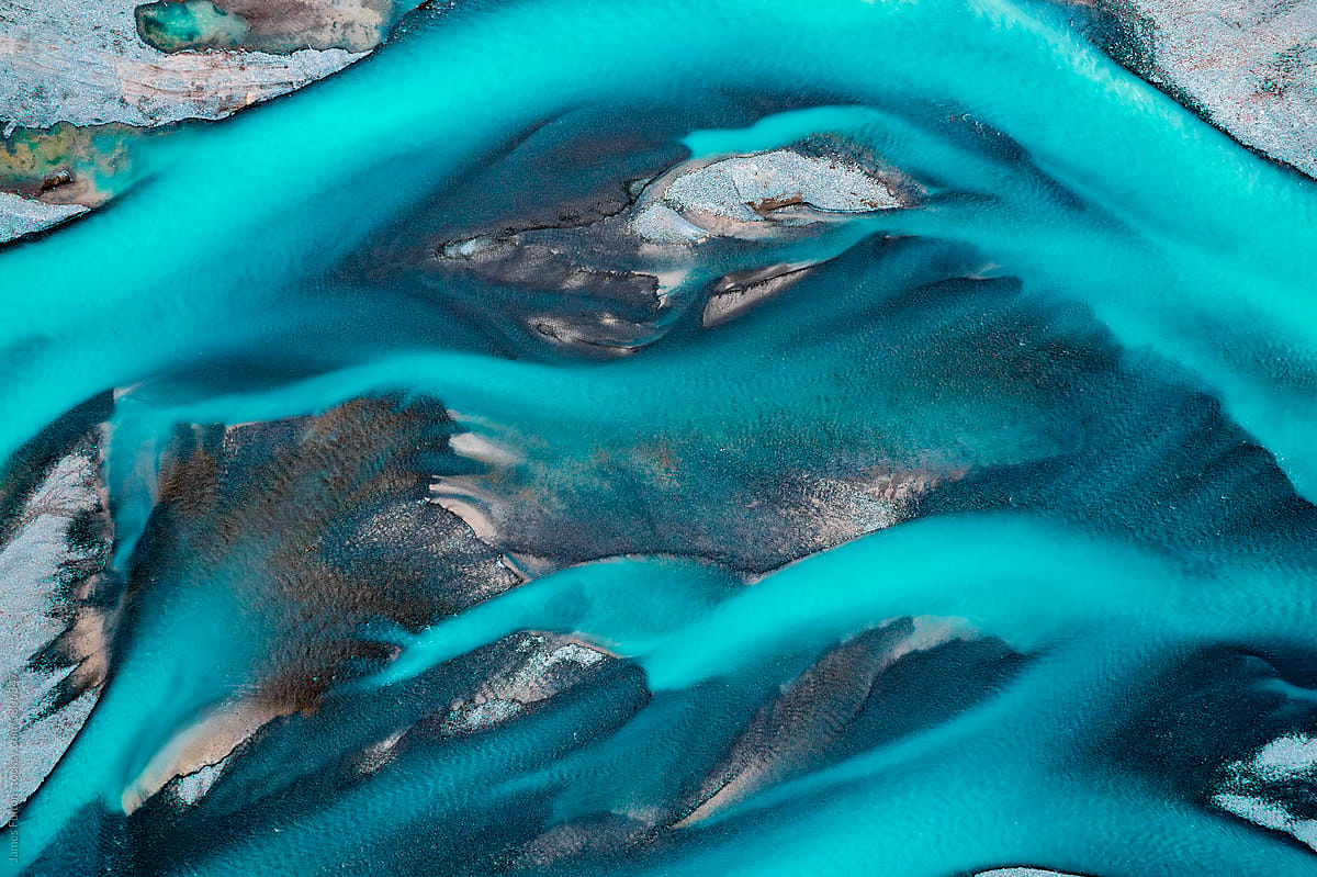 Aerial Turquoise Abstract of river braids looking like blue flames.