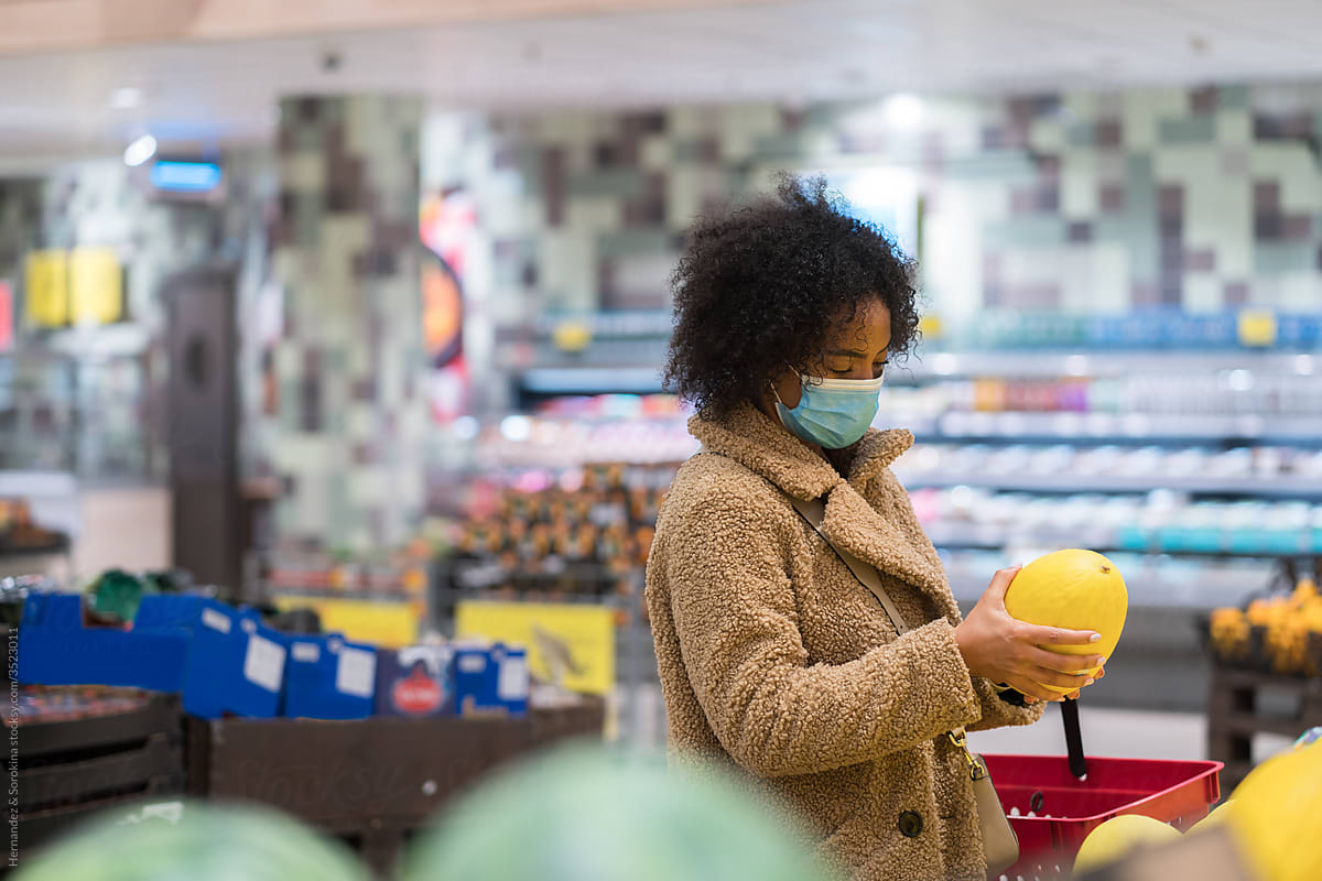 Female Costumer Wearing Mask At Supermarket