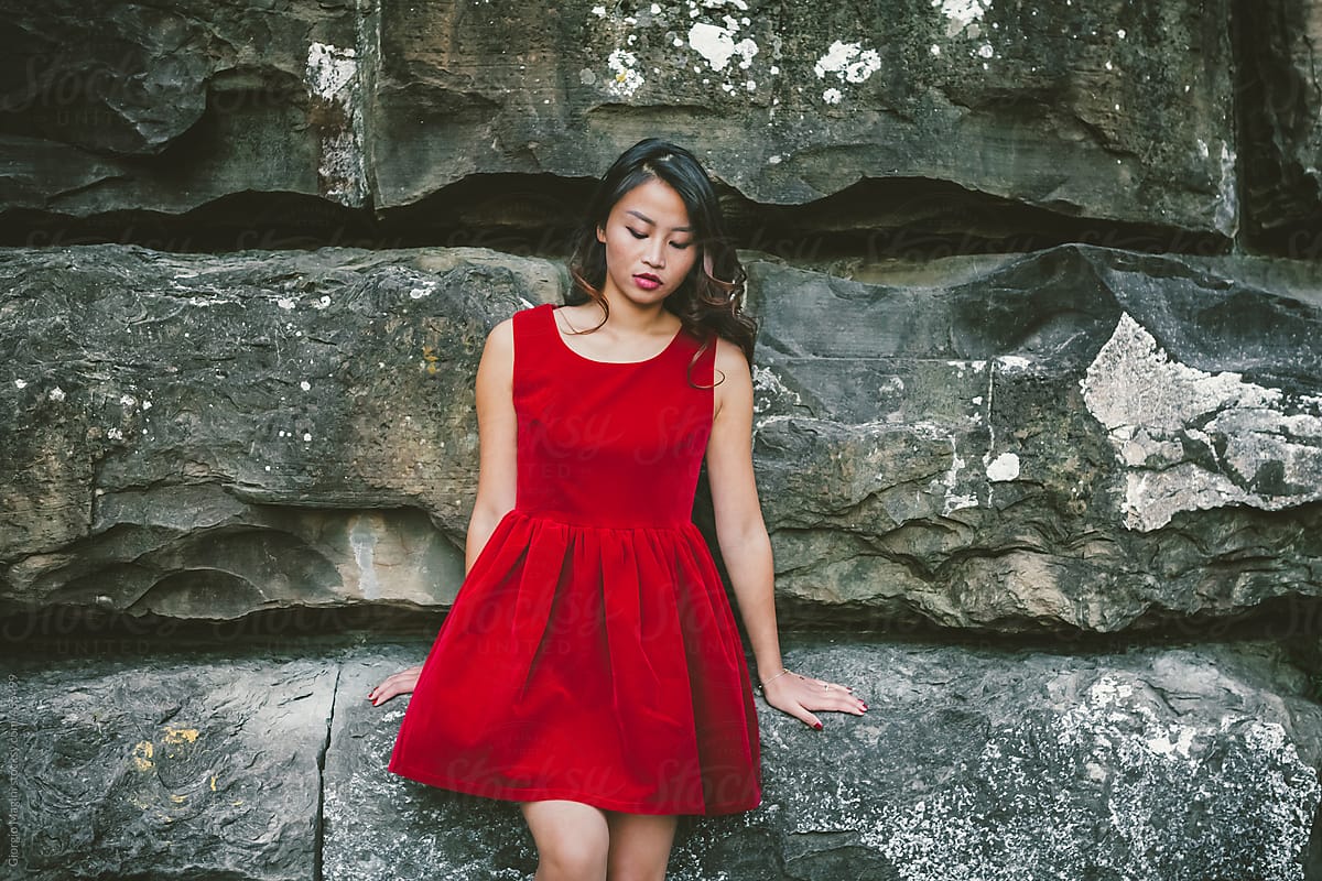 Mysterious Young Asian Woman with Red Dress