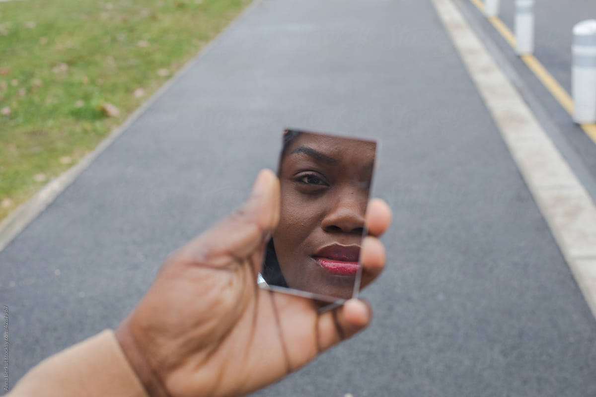 identity, black woman face in the mirror, strange portrait