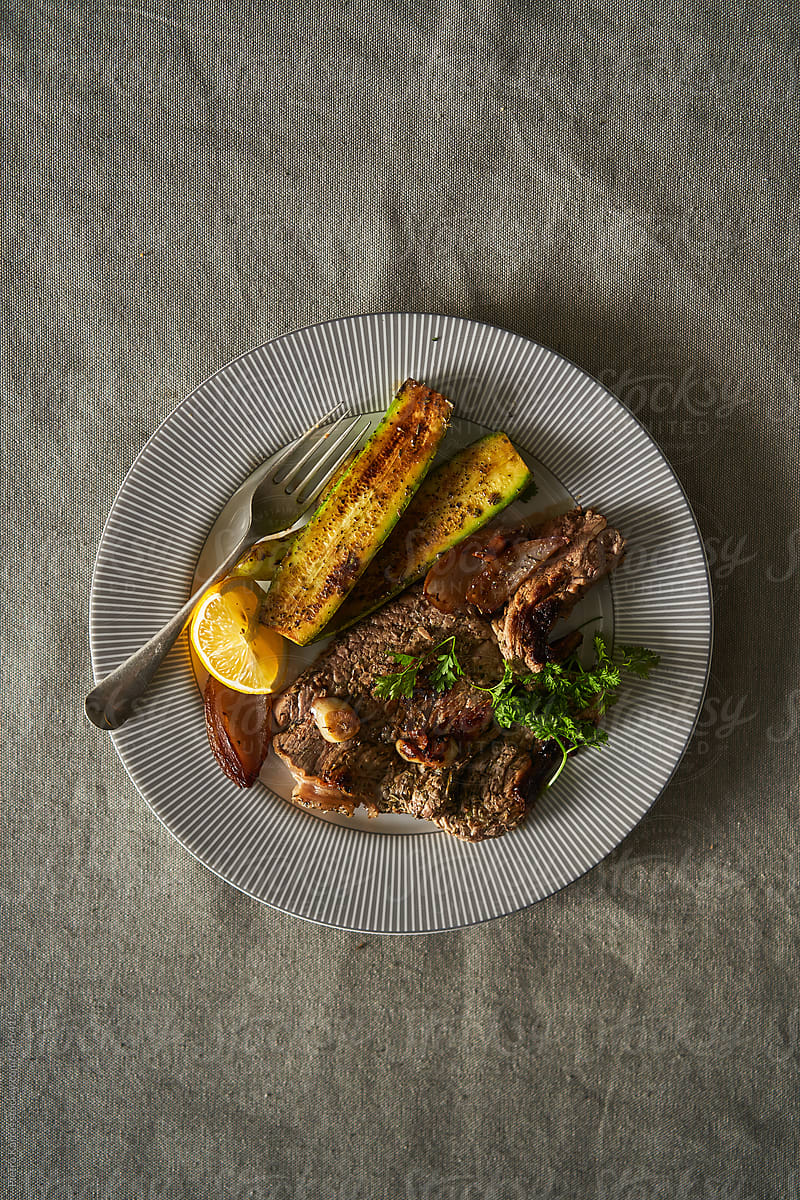 Roasted meat steak with zucchini