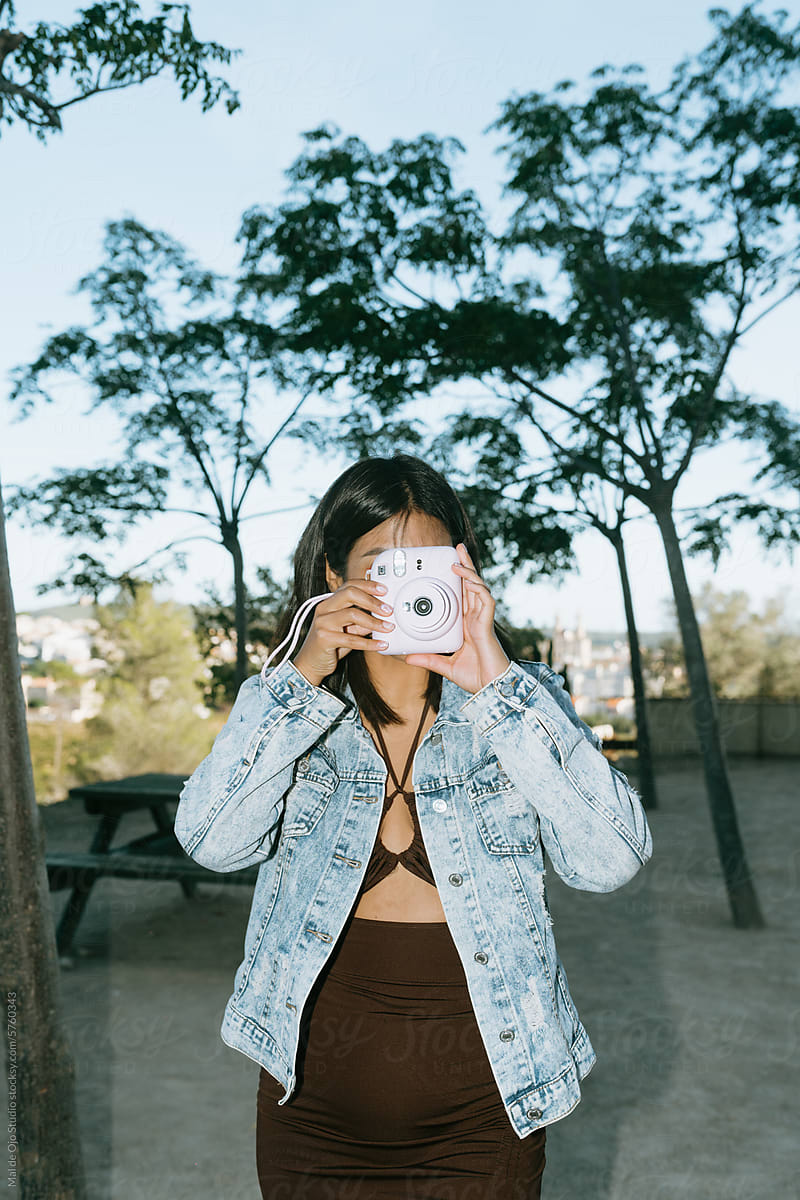 Woman with Instant Camera