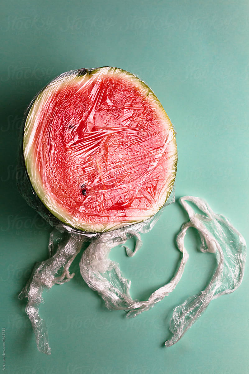 A watermelon covered by plastic