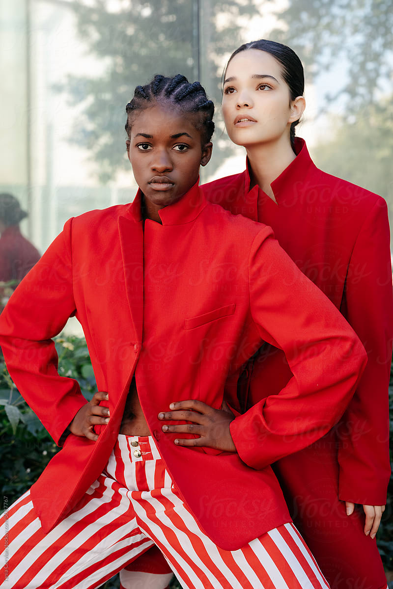 Trendy multiracial women in red apparels
