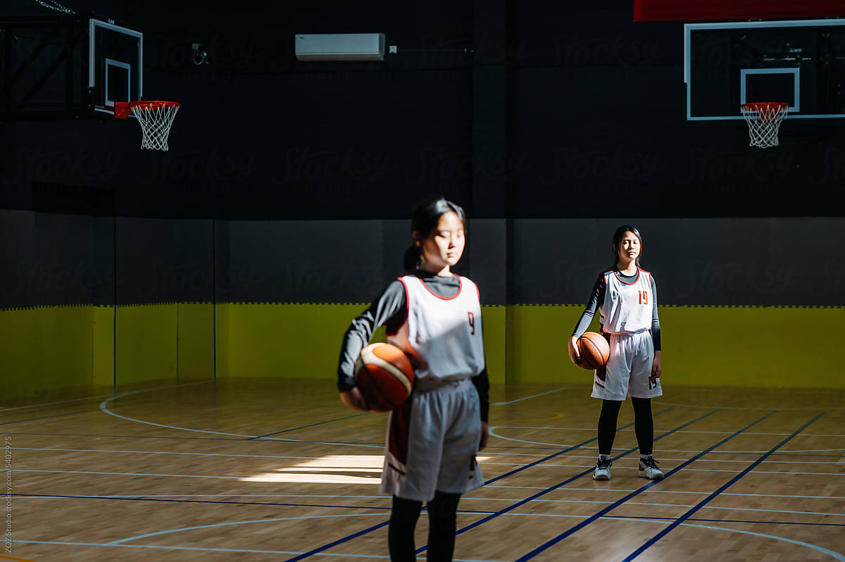Portrait of basketball girls standing in a gym