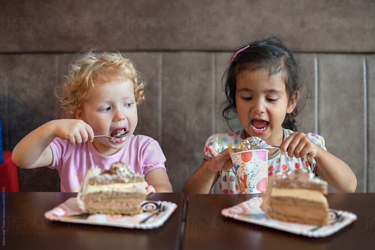 Little Girl Eating Cake