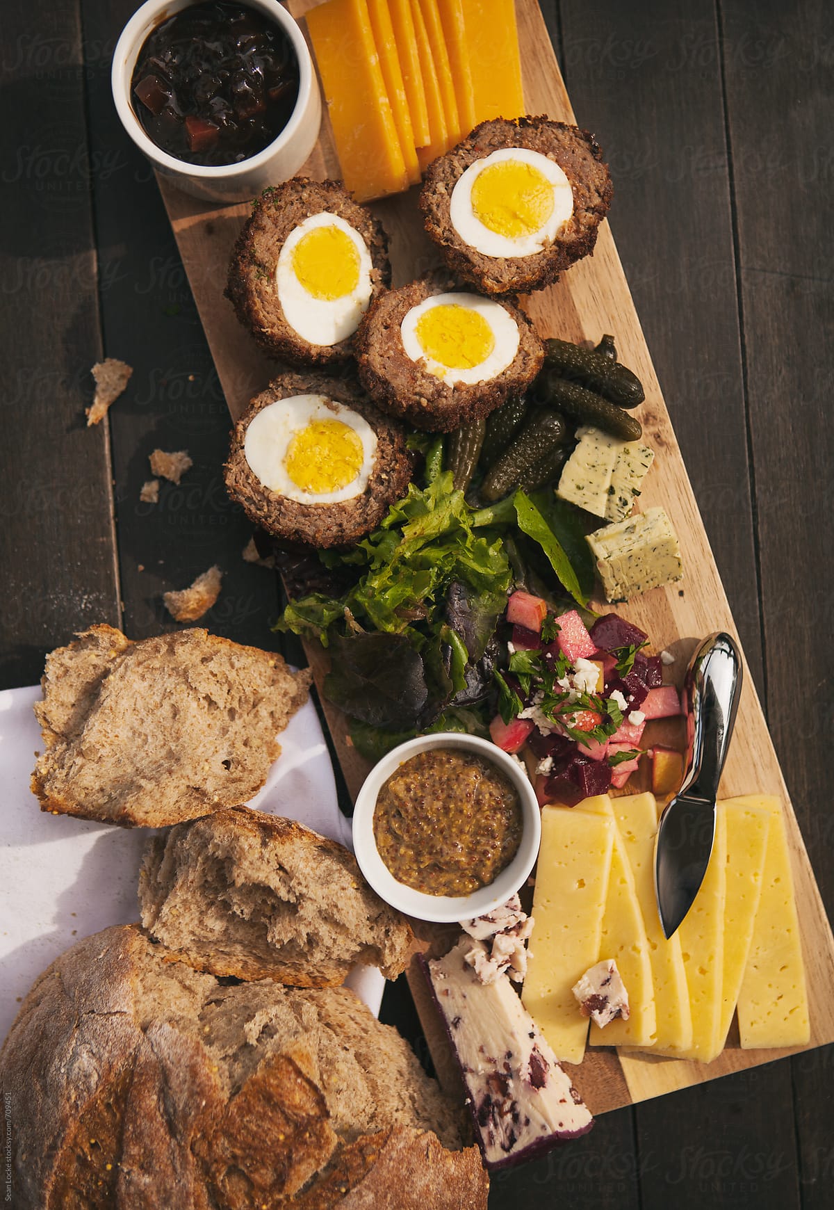 Variety Of Cheeses And Salads On British Ploughman\'s Plate