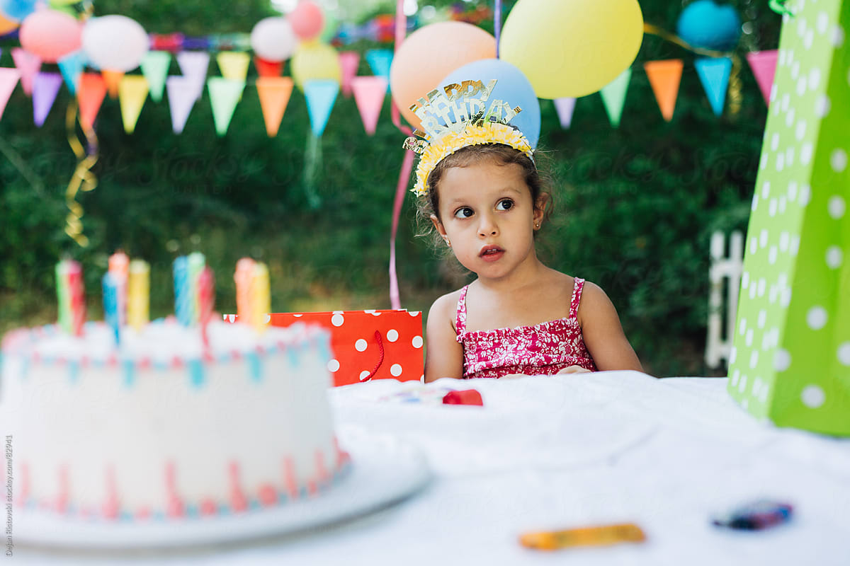 Child sitting on a birthday party