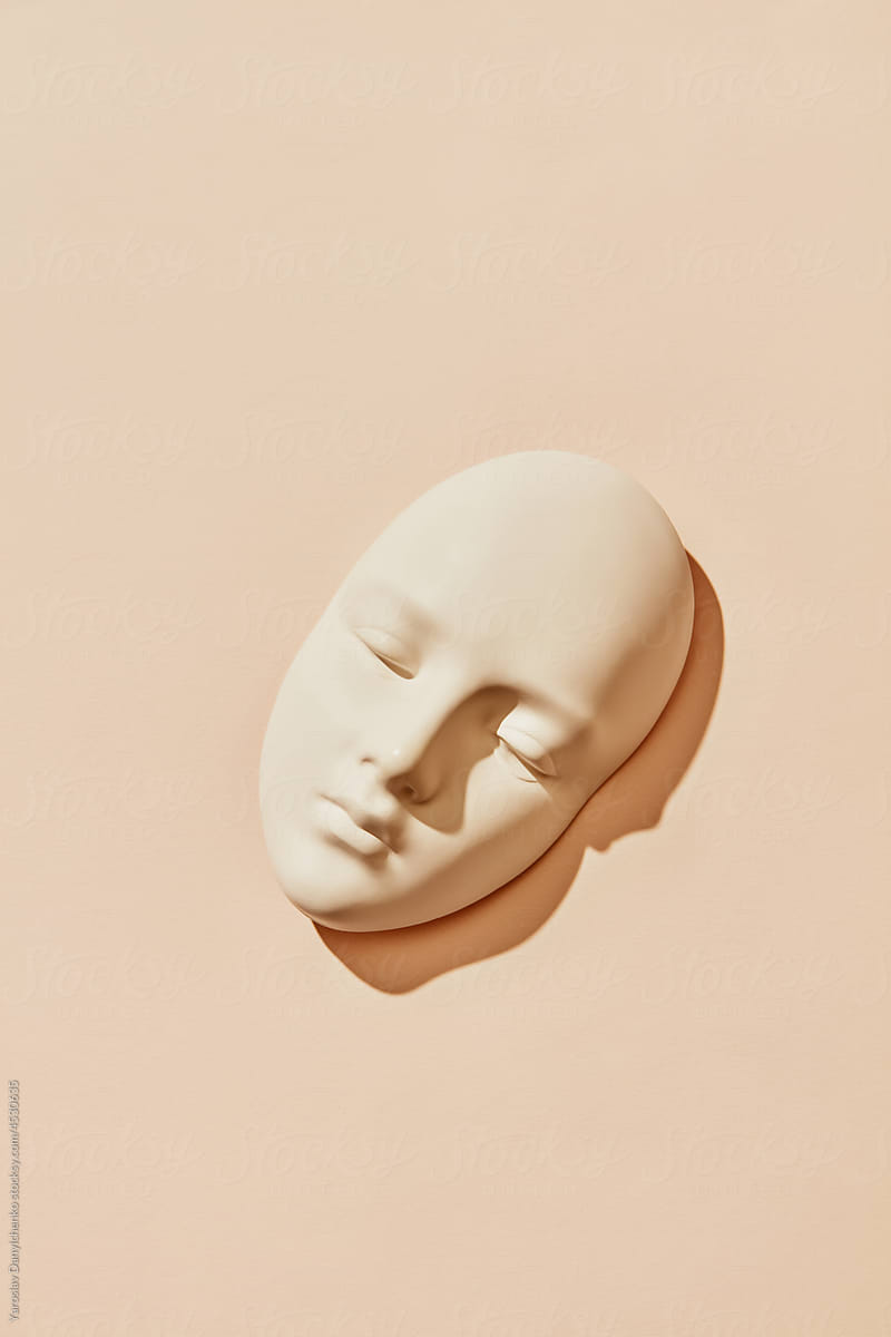 Plaster mask of female face with closed eyes
