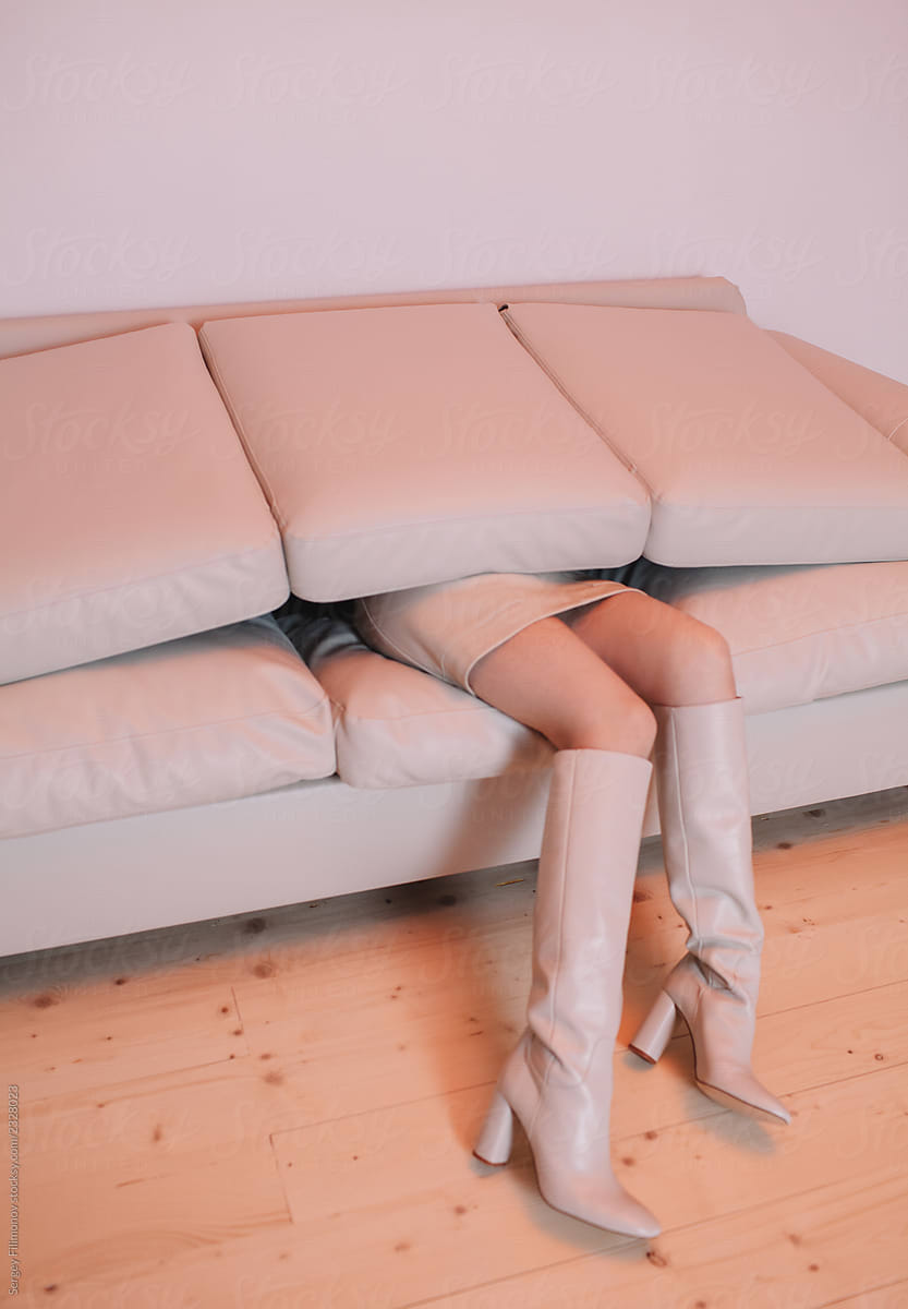Anonymous Female Buried Under Cushions By Stocksy Contributor Sergey