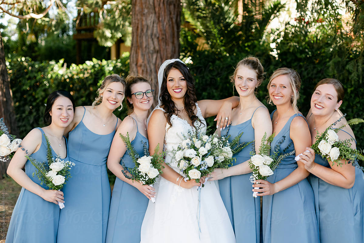Smiling Bride and Bridesmaids Pose for Portrait
