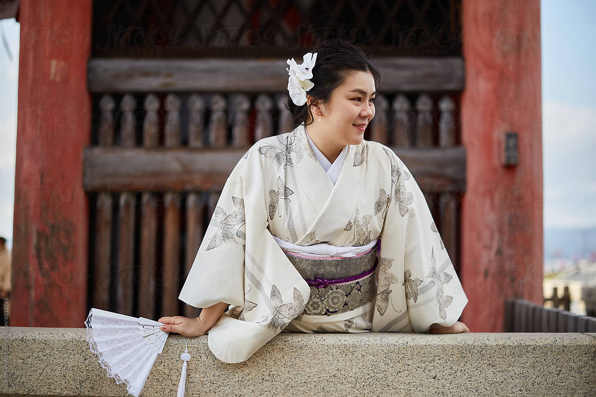 Happy Asian Woman Wearing A Kimono In Kyoto, Japan.