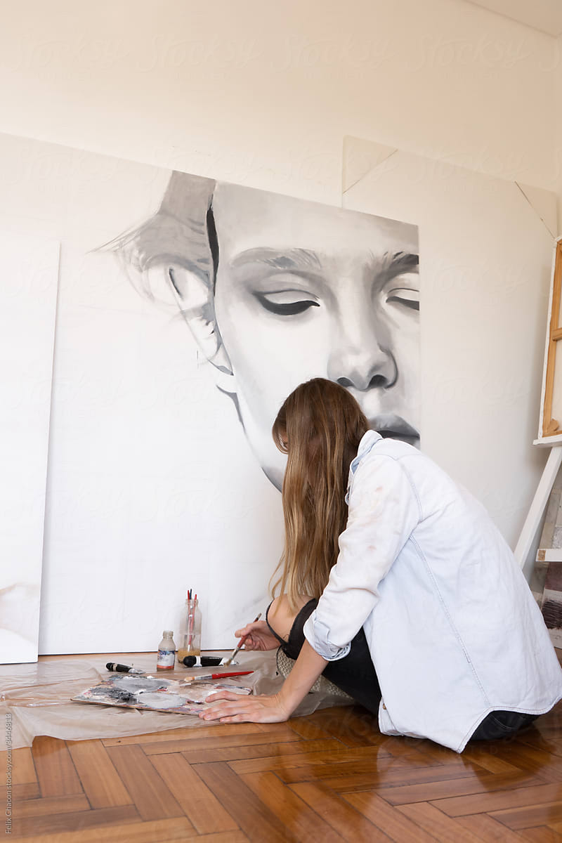 Woman Painting A Portrait